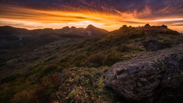 Scenic mountain trail with soft natural light and open landscape